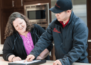 A technician guiding a customer